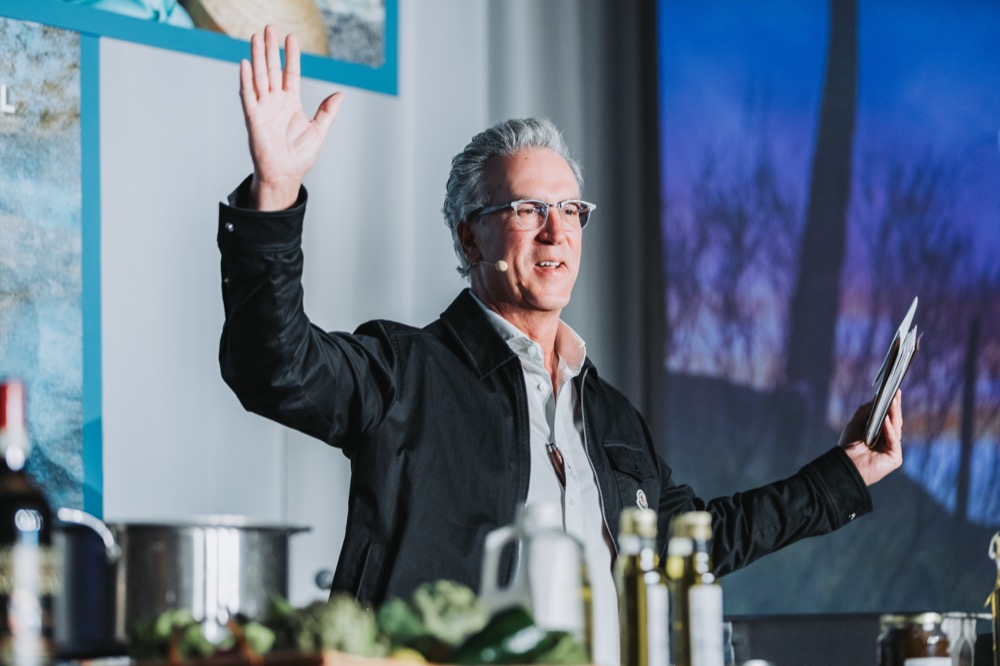 Speaker presenting from a stage podium