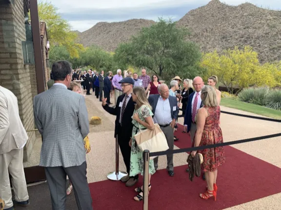 Guests lining up on a red carpet