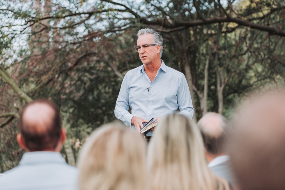 Marshall Pennell speaking to an outdoor audience