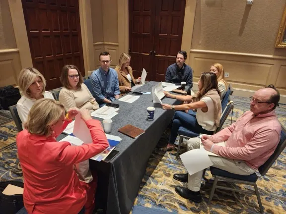 Philanthropy advisors collaborating on a fundraising strategy